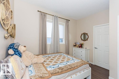 Bedroom with dark wood-style flooring and baseboards - 3128 13 Avenue, Edmonton, AB - Indoor Photo Showing Bedroom