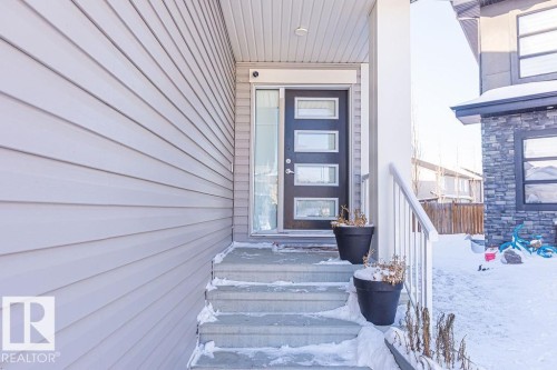 Entrance to property with stone siding - 3128 13 Avenue, Edmonton, AB - Outdoor With Exterior