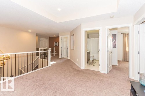 Hallway with light colored carpet, an upstairs landing, and recessed lighting - 3128 13 Avenue, Edmonton, AB - Indoor Photo Showing Other Room