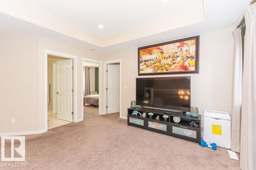 Living room with light colored carpet and baseboards - 3128 13 Avenue, Edmonton, AB - Indoor