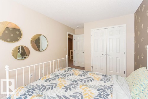 Carpeted bedroom with a closet - 3128 13 Avenue, Edmonton, AB - Indoor Photo Showing Bedroom