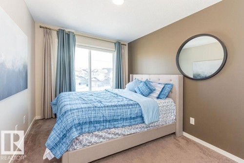 Carpeted bedroom featuring baseboards - 3128 13 Avenue, Edmonton, AB - Indoor Photo Showing Bedroom