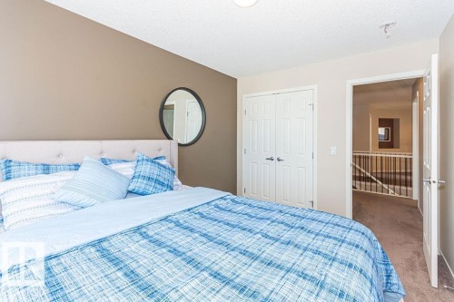 Carpeted bedroom with a closet - 3128 13 Avenue, Edmonton, AB - Indoor Photo Showing Bedroom