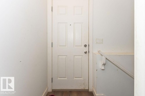 Doorway featuring wood finished floors and baseboards - 3128 13 Avenue, Edmonton, AB - Indoor Photo Showing Other Room