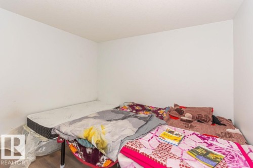 Bedroom featuring wood finished floors - 3128 13 Avenue, Edmonton, AB - Indoor Photo Showing Bedroom