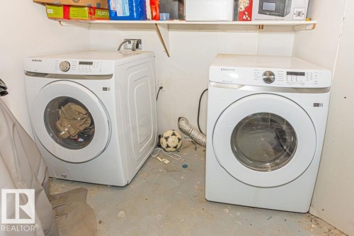 Laundry area with unfinished concrete flooring and washer and clothes dryer - 3128 13 Avenue, Edmonton, AB - Indoor Photo Showing Laundry Room