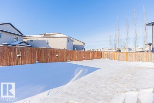 Fenced backyard featuring a residential view - 3128 13 Avenue, Edmonton, AB - Outdoor