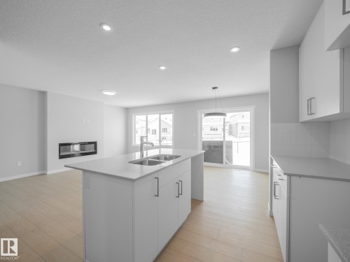 86 Baker Street, Ardrossan, AB - Indoor Photo Showing Kitchen With Double Sink
