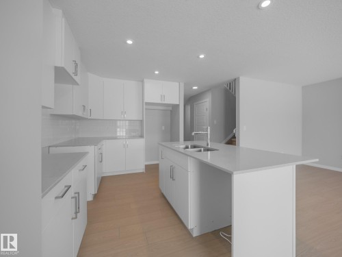 86 Baker Street, Ardrossan, AB - Indoor Photo Showing Kitchen With Double Sink
