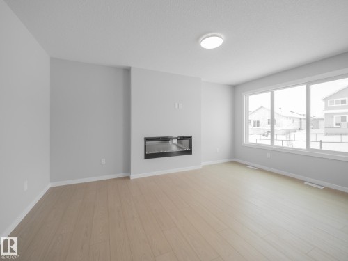 86 Baker Street, Ardrossan, AB - Indoor With Fireplace
