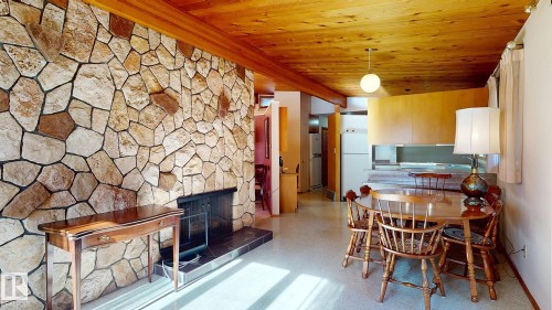13 Valleyview Crescent, Edmonton, AB - Indoor Photo Showing Dining Room With Fireplace