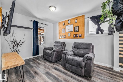 Living room featuring wood finished floors and baseboards - 5911 119 Avenue, Edmonton, AB - Indoor