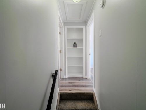 Stairs featuring wood finished floors and built in features - 5911 119 Avenue, Edmonton, AB - Indoor Photo Showing Other Room