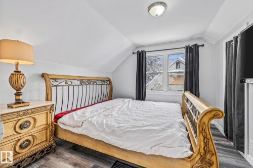 Bedroom with dark wood finished floors - 5911 119 Avenue, Edmonton, AB - Indoor Photo Showing Bedroom