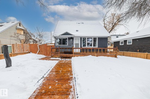 View of front facade with a fenced backyard and a deck - 5911 119 Avenue, Edmonton, AB - Outdoor With Deck Patio Veranda