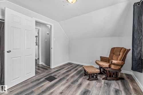 Bedroom with vaulted ceiling and wood finished floors - 5911 119 Avenue, Edmonton, AB - Indoor Photo Showing Other Room