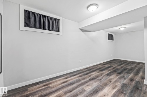 Recreation Room featuring dark wood-style flooring - 5911 119 Avenue, Edmonton, AB - Indoor Photo Showing Other Room