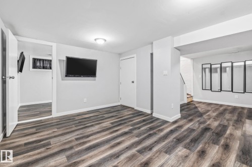 Recreation Room featuring dark wood-type flooring - 5911 119 Avenue, Edmonton, AB - Indoor Photo Showing Other Room