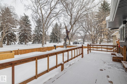 Snowy yard featuring a wooden deck - 5911 119 Avenue, Edmonton, AB - Outdoor