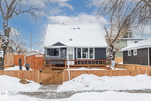 View of front facade featuring a wooden deck - 5911 119 Avenue, Edmonton, AB - Outdoor With Deck Patio Veranda