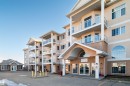 View of apartment building / complex - 402 7803 Golf Course Road, Stony Plain, AB  - Outdoor With Balcony With Facade 