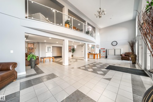 Community lobby with a high ceiling - 402 7803 Golf Course Road, Stony Plain, AB - Indoor Photo Showing Other Room