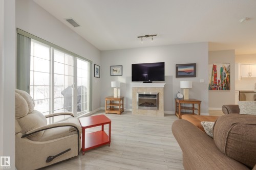 215 1003 Gault Boulevard, Edmonton, AB - Indoor Photo Showing Living Room With Fireplace