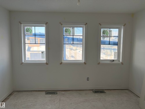 Empty room with baseboards - 8923 Elves Loop, Edmonton, AB - Indoor Photo Showing Other Room