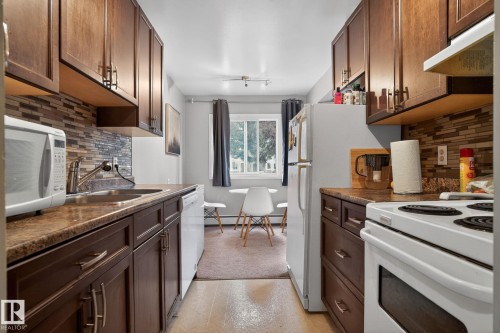 120 5730 Riverbend Road, Edmonton, AB - Indoor Photo Showing Kitchen With Double Sink