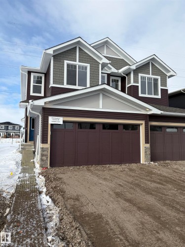 Craftsman house with stone siding and dirt driveway - 5756 Hawthorn Common, Edmonton, AB - Outdoor