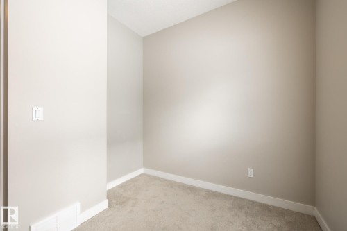 127 2560 Pegasus Boulevard, Edmonton, AB - Indoor Photo Showing Other Room