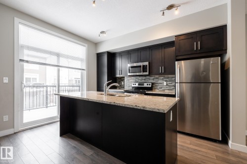 127 2560 Pegasus Boulevard, Edmonton, AB - Indoor Photo Showing Kitchen With Stainless Steel Kitchen With Upgraded Kitchen