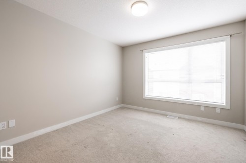127 2560 Pegasus Boulevard, Edmonton, AB - Indoor Photo Showing Other Room