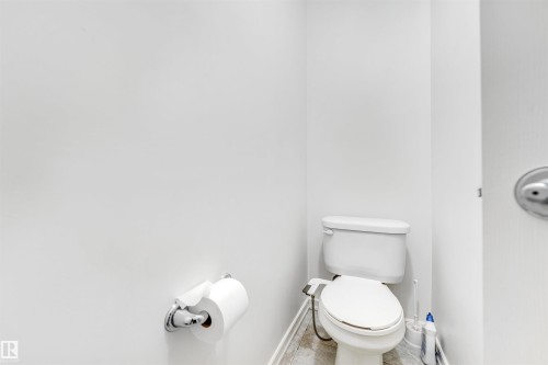 Bathroom featuring toilet and baseboards - 3449 28 Street, Edmonton, AB - Indoor Photo Showing Bathroom