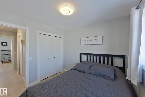 Bedroom with a closet and light wood-style floors - 121 1 Aberdeen Way, Stony Plain, AB - Indoor Photo Showing Bedroom