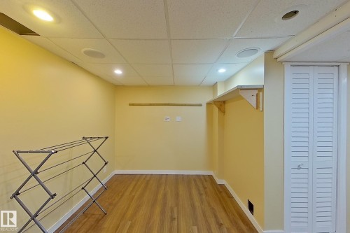 Walk in closet featuring a paneled ceiling and light wood finished floors - 121 1 Aberdeen Way, Stony Plain, AB - Indoor