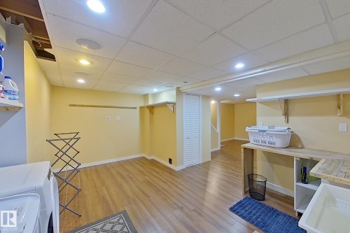 Interior space featuring a paneled ceiling, recessed lighting, and light wood-type flooring - 121 1 Aberdeen Way, Stony Plain, AB - Indoor Photo Showing Other Room