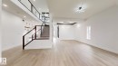 Unfurnished living room featuring stairs, light wood-style floors, and recessed lighting - 1707 18 Street, Edmonton, AB  - Indoor Photo Showing Other Room 