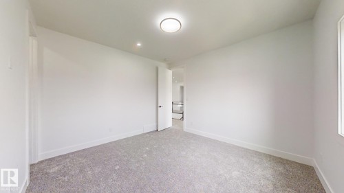 Unfurnished room featuring carpet flooring and recessed lighting - 1707 18 Street, Edmonton, AB - Indoor Photo Showing Other Room