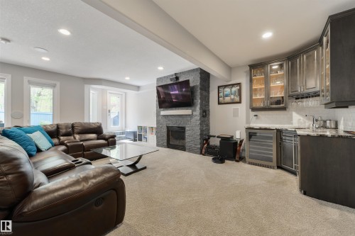 14 Prestige Point(E), Edmonton, AB - Indoor Photo Showing Living Room With Fireplace