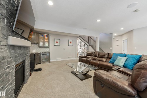 14 Prestige Point(E), Edmonton, AB - Indoor Photo Showing Living Room With Fireplace