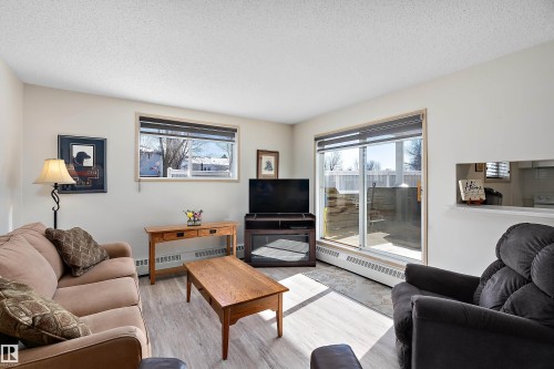 Living room featuring light flooring - 116 11620 9A Avenue, Edmonton, AB - Indoor Photo Showing Living Room
