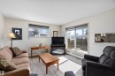 Living room featuring light flooring - 116 11620 9A Avenue, Edmonton, AB  - Indoor Photo Showing Living Room 