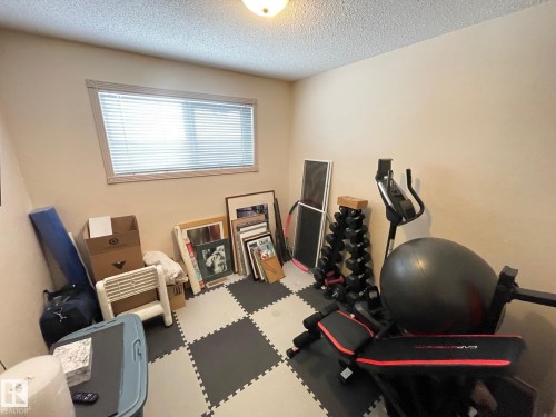 Bedroom with a textured ceiling - 324 Warwick Road, Edmonton, AB - Indoor Photo Showing Other Room