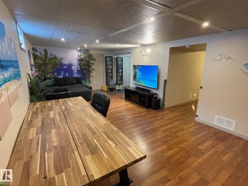 Living room featuring dark wood-style flooring - 324 Warwick Road, Edmonton, AB - Indoor Photo Showing Other Room