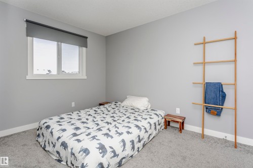 Bedroom with light colored carpet - 16420 15 Avenue, Edmonton, AB - Indoor Photo Showing Bedroom