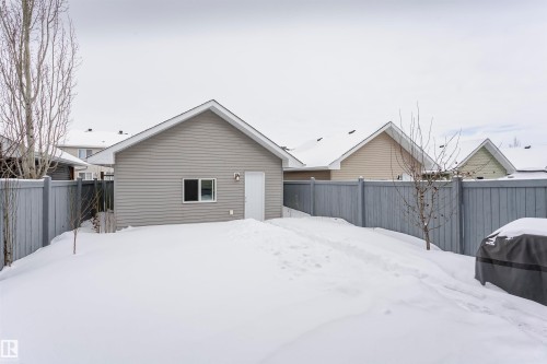 Snow covered property featuring a fenced backyard - 16420 15 Avenue, Edmonton, AB - Outdoor