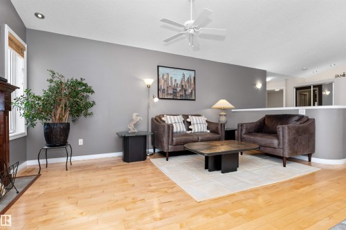 Living area with lofted ceiling, light wood-type flooring, and ceiling fan - 357 Blackburn Drive E, Edmonton, AB - Indoor Photo Showing Living Room