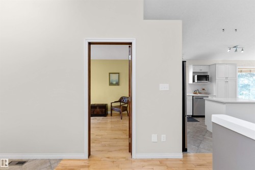 Hall featuring light wood-style floors and baseboards - 357 Blackburn Drive E, Edmonton, AB - Indoor
