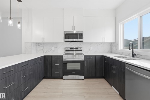 317 Juniper Cove, Leduc, AB - Indoor Photo Showing Kitchen With Double Sink With Upgraded Kitchen
